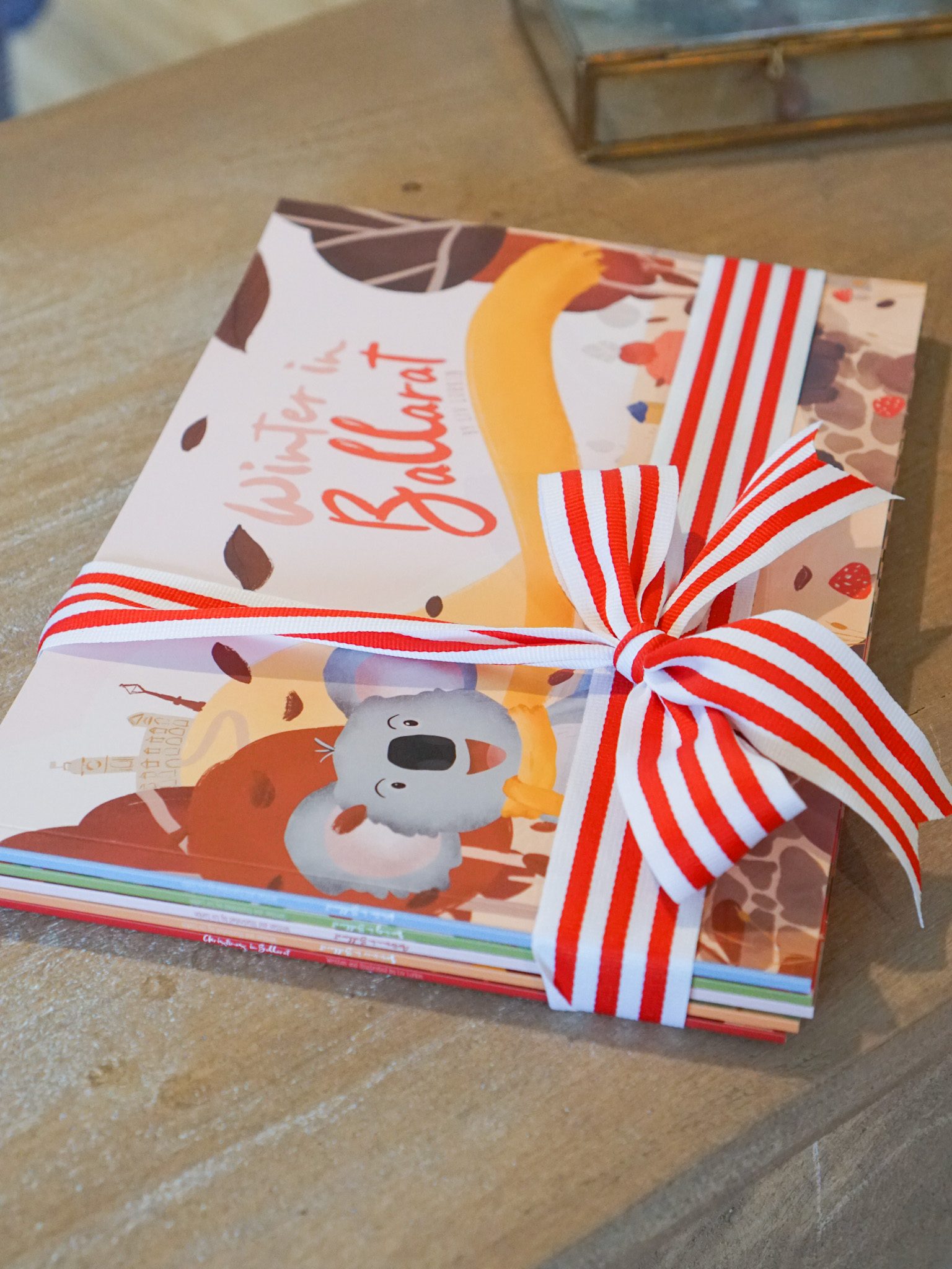 5 book stack of Liv Lorkins children's books from her Ballarat series. A red and white ribbon is tied around the front.